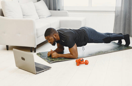 Busy professional doing a quick home workout to stay fit despite a tight schedule