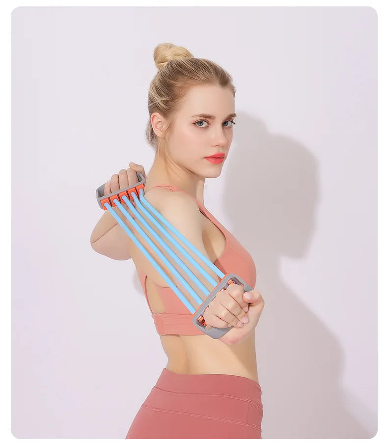 Person performing shoulder stretch exercises at home using a chest expander stretch rope