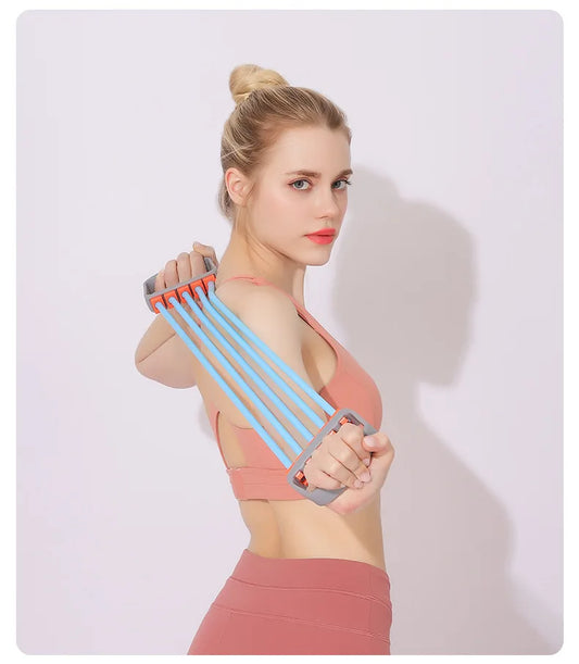 Person performing shoulder stretch exercises at home using a chest expander stretch rope