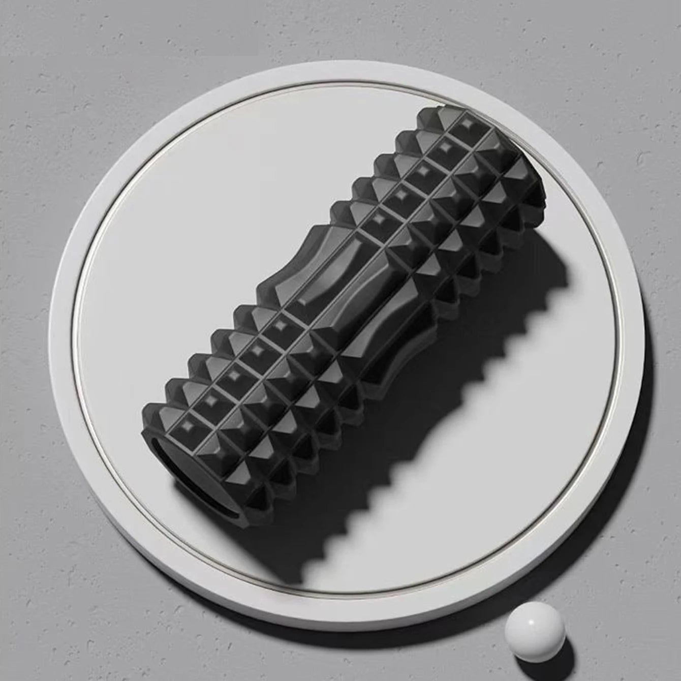 Black foam roller set including block and massage column for yoga and Pilates
