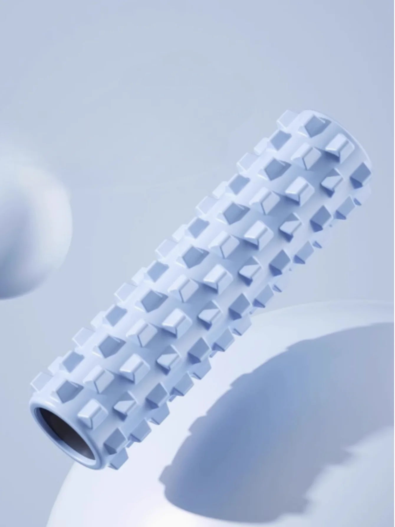 Blue yoga foam roller, yoga block, and massage column for muscle recovery
