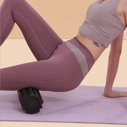 Yoga and Pilates stretching with foam roller and block for flexibility