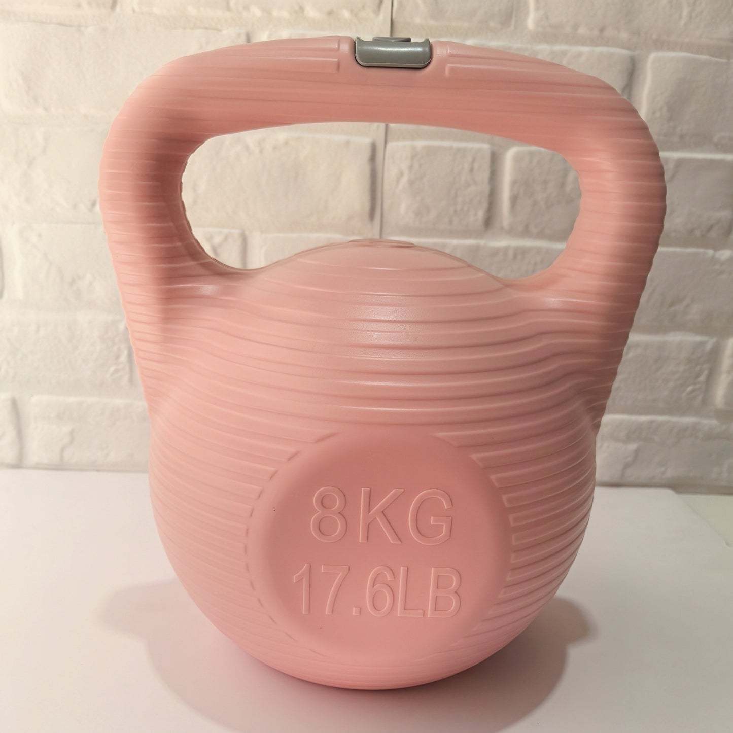 Pink 8kg kettlebell for a functional training 