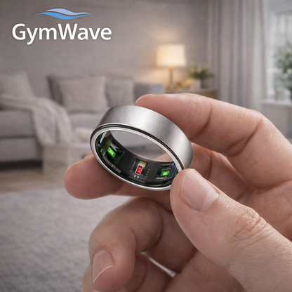 Person holding GymWave smart ring in a modern home setting, showing sleek silver fitness ring design