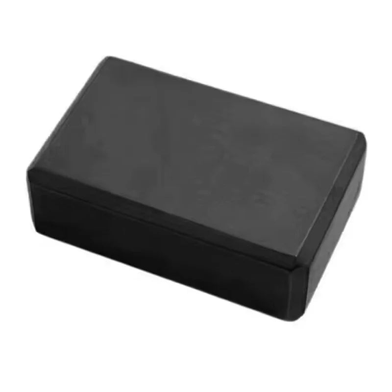 Black pilates bricks providing stability during fitness exercises