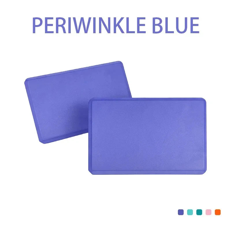 Blue yoga blocks assisting in strength training exercises